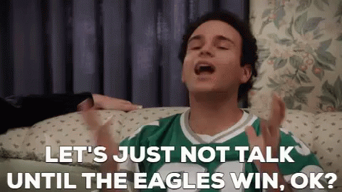 Man in Green and White Jersey Talking