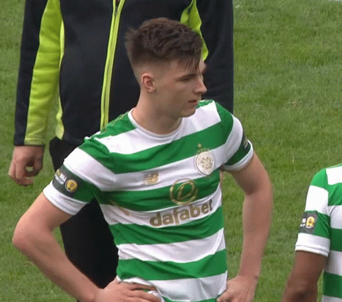 Man in Green and White Striped Shirt