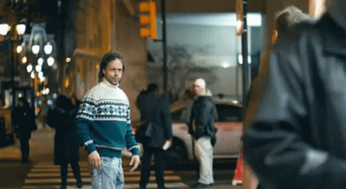 Man in Green and White Sweater Walking