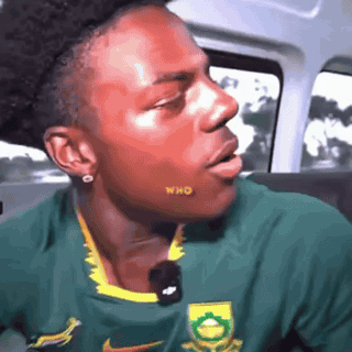 Man In Green And Yellow Nike Shirt In Car GIF