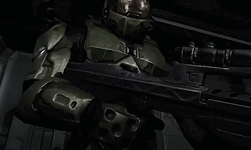 Man In Green Armor Holding Rifle With Letter E GIF