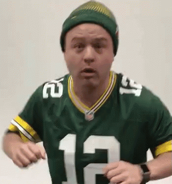 Man In Green Bay Packers Jersey And Beanie Dancing GIF