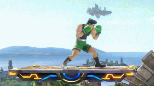 Man in Green Boxing Gloves on Platform