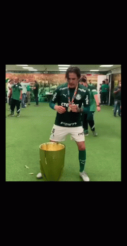 Man In Green Crefisa Shirt Before Trophy