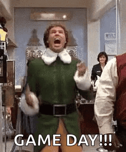 Man in Green Elf Costume Celebrating