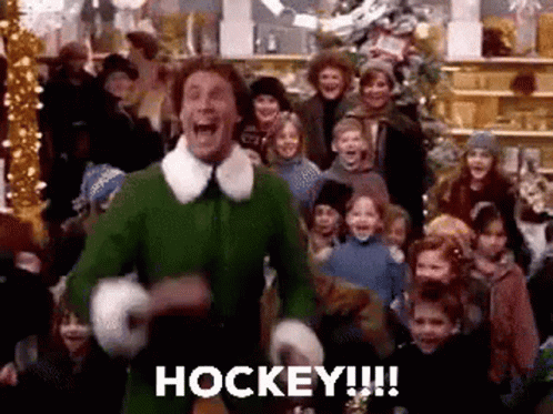 Man in Green Elf Costume Holding Hockey Stick