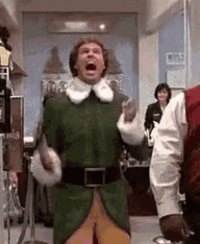 Man in Green Elf Costume Screaming