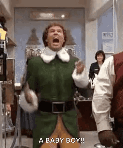 Man in Green Elf Costume Shouting Baby