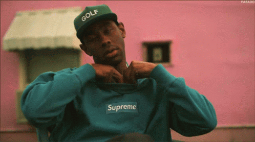 Man In Green Hat And Blue Supreme Sweatshirt GIF