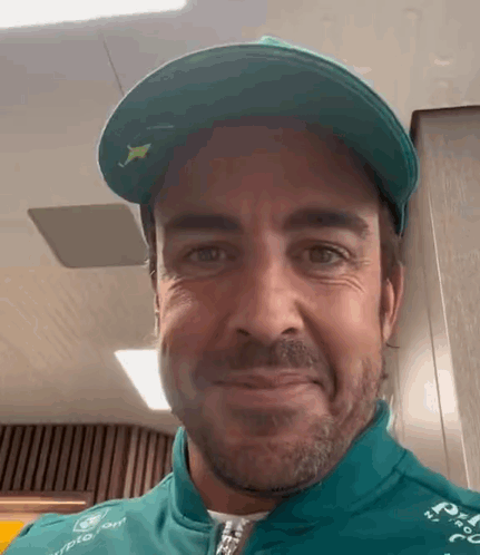 Man In Green Hat And Jacket Smiling GIF