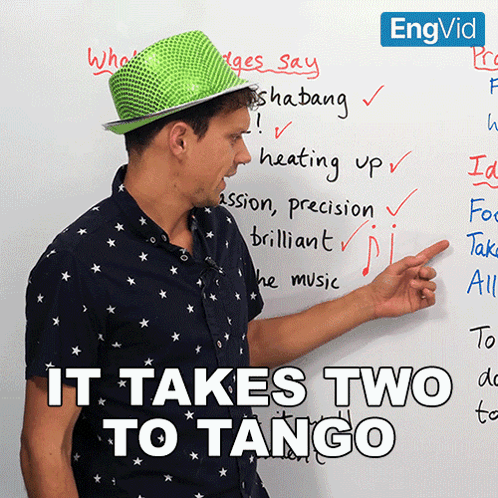 Man in Green Hat Pointing at It Takes Two to Tango