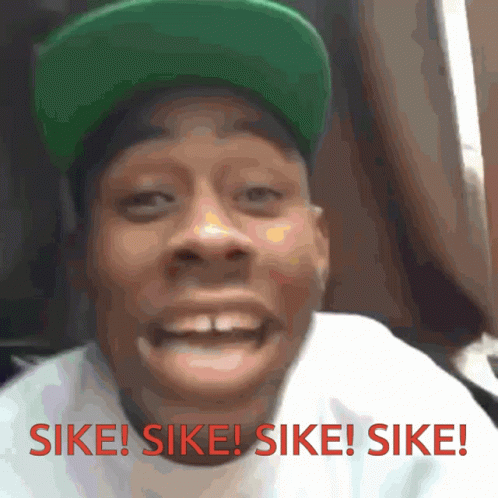 Man in Green Hat Saying Sike