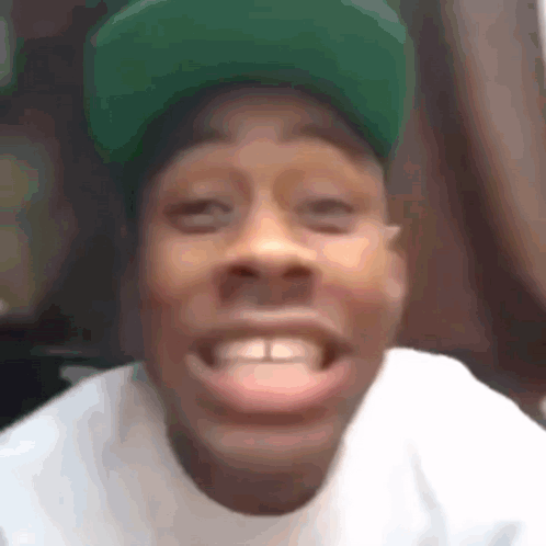 Man in Green Hat Smiling
