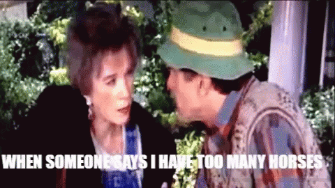 Man in Green Hat Talking to Woman Saying When Someone Says I Have Too Many Horses