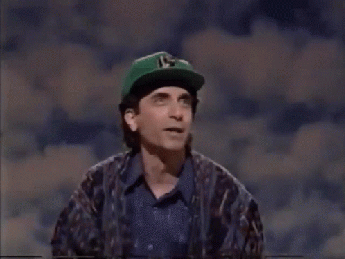 Man in Green Hat With Number 15 Next to Woman