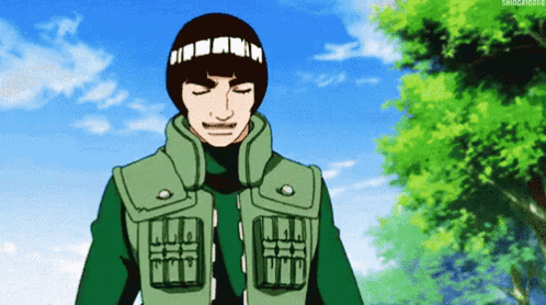 Man in Green Jacket and Headband with Letter T