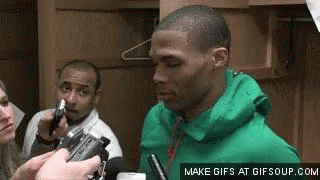 Man In Green Jacket Interviewed By Reporter In Locker Room GIF