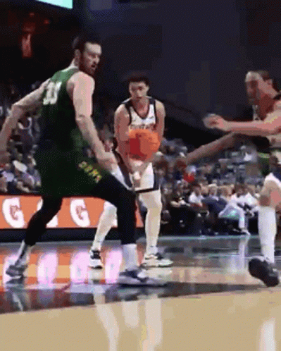 Man in Green Jersey Number 23 Playing Basketball
