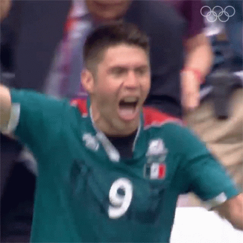 Man in Green Jersey Number 9 Screaming