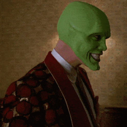 Man in Green Mask and Red Jacket Smiling