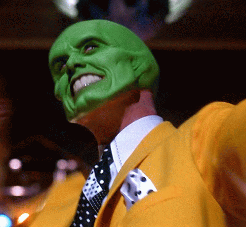 Man In Green Mask And Yellow Jacket With Tie GIF