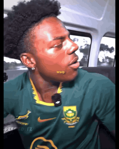 Man In Green Nike Shirt With Who On Cheek GIF