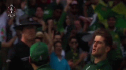 Man in Green Pakistan Jersey in Front of Crowd