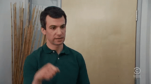 Man in Green Polo Making Funny Face At Door