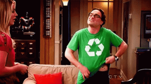 Man in Green Recycling Shirt Standing With Woman