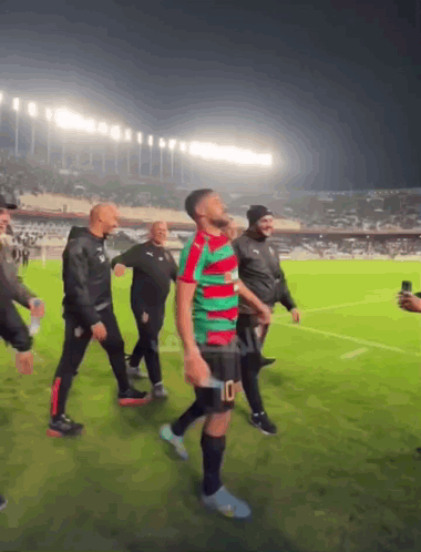 Man In Green Red Jersey Number 10 Shorts GIF