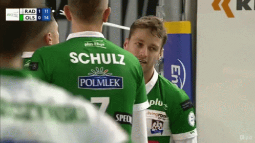 Man in Green Schulz Polmlek Jersey Talking