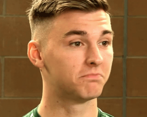 Man in Green Shirt Close Up