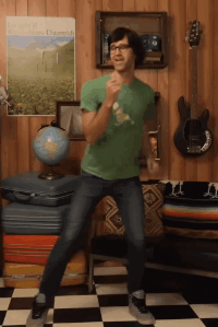 Man in Green Shirt Dancing in Front of The World Poster
