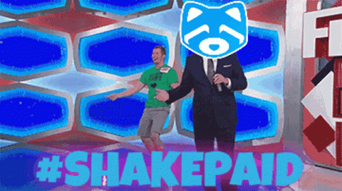 Man in Green Shirt Escorted by Man in Suit on Stage #Shakepaid