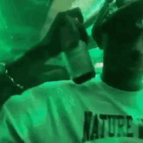 Man In Green Shirt Holding Beer GIF