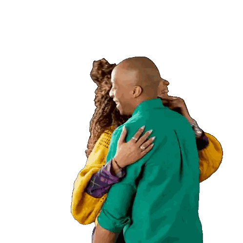 Man in Green Shirt Hugging Woman in Yellow