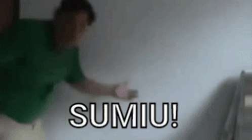 Man in Green Shirt in Front of Sumiu