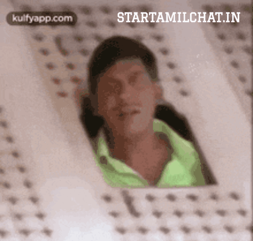 Man In Green Shirt Looking Out Window GIF