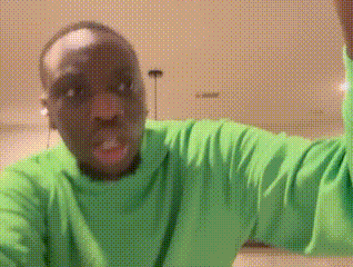 Man In Green Shirt Making A Face GIF