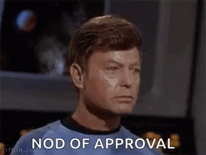 Man In Green Shirt Nods Approval GIF