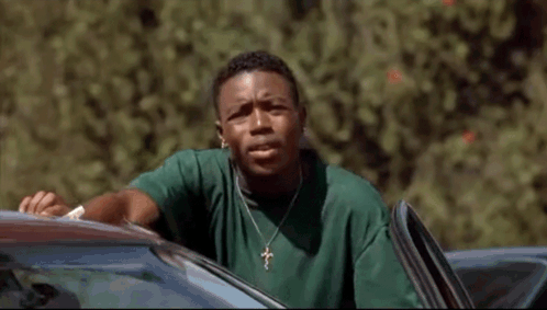 Man in Green Shirt Pushes Woman Out of Car