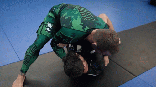 Man in Green Shirt Saying Jiu-Jitsu