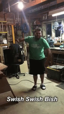 Man in Green Shirt Saying League Champions Dancing in Garage