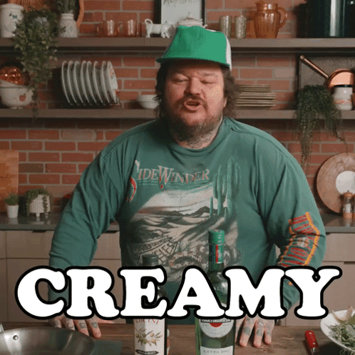 Man In Green Shirt Saying Sidewinder In Front Of Creamy Bottle GIF