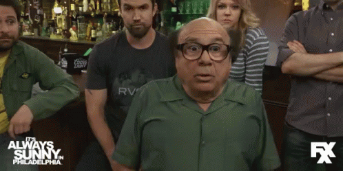 Man in Green Shirt Says Whoops to Crowd