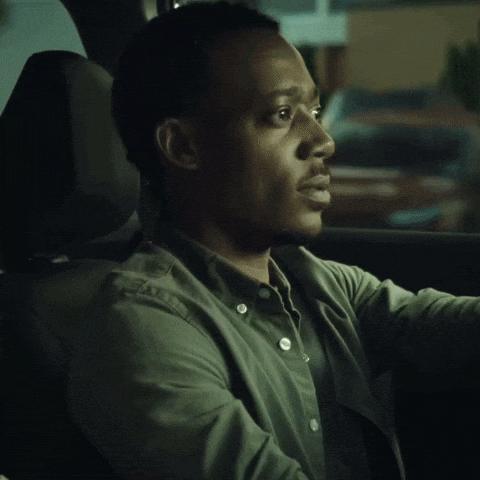 Man In Green Shirt Sitting In Car GIF