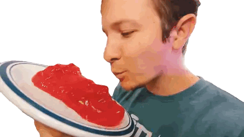 Man in Green Shirt Smelling Ketchup
