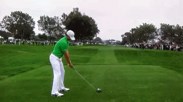 Man In Green Shirt Swinging Golf Club GIF