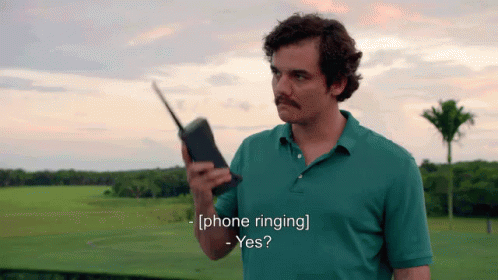 Man in Green Shirt Walkie Talkie Phone Ringing