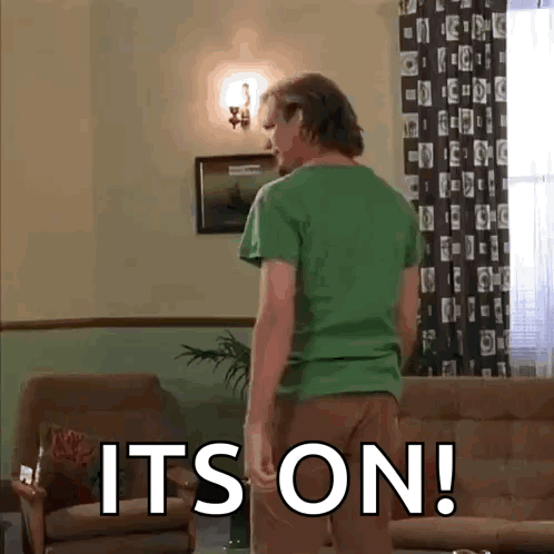 Man in Green Shirt with It's On Floor